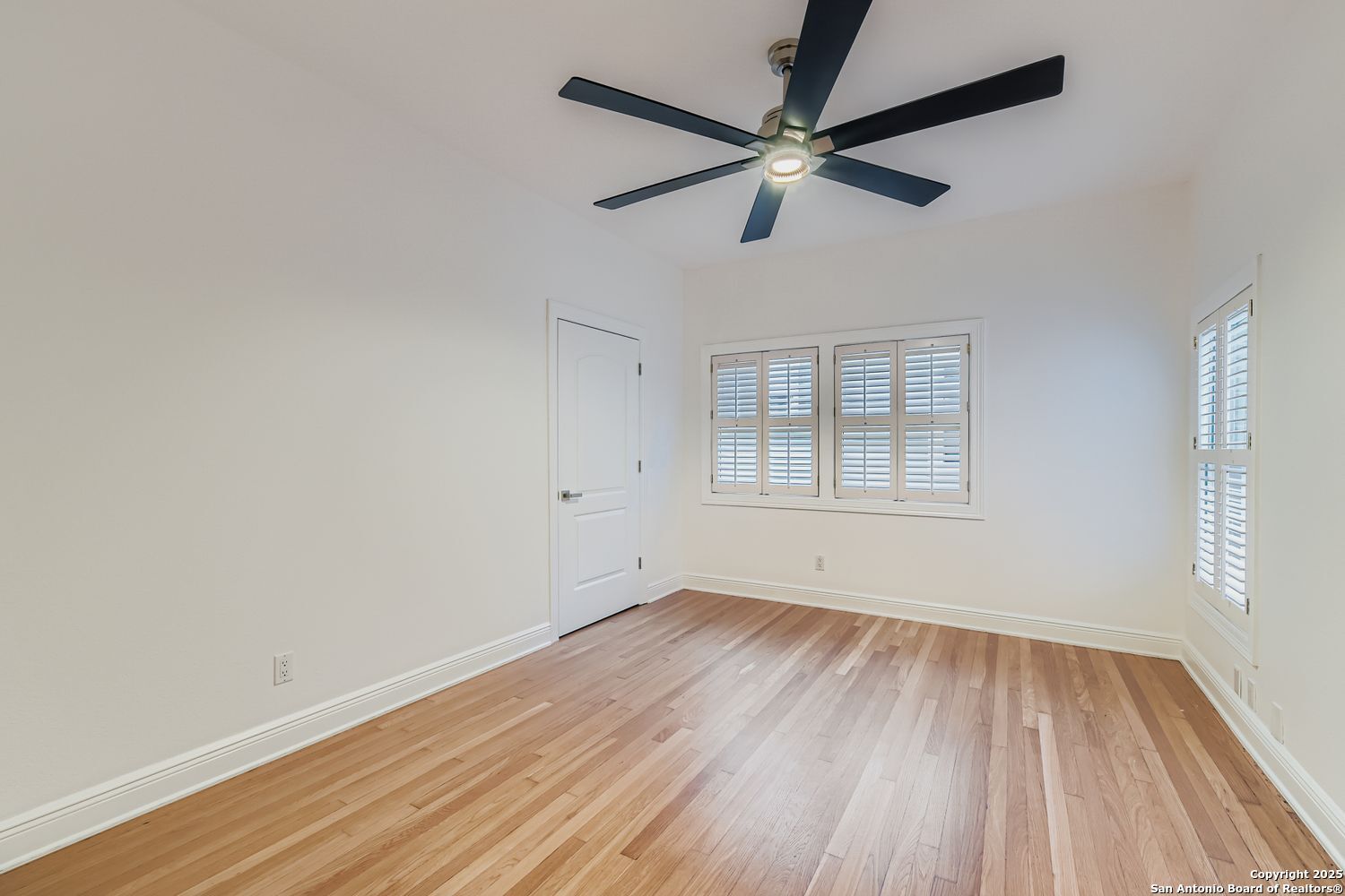 211 Elizabeth Road Terrell Hills, TX 78209 - Photo 11 of 29 wooden floor in an empty room with a window