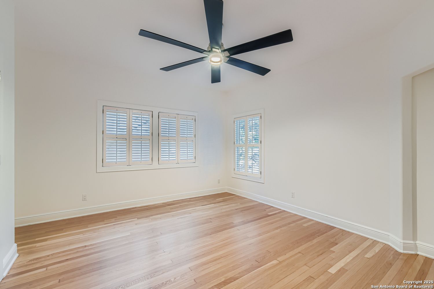 211 Elizabeth Road Terrell Hills, TX 78209 - Photo 15 of 29 wooden floor in an empty room with a window
