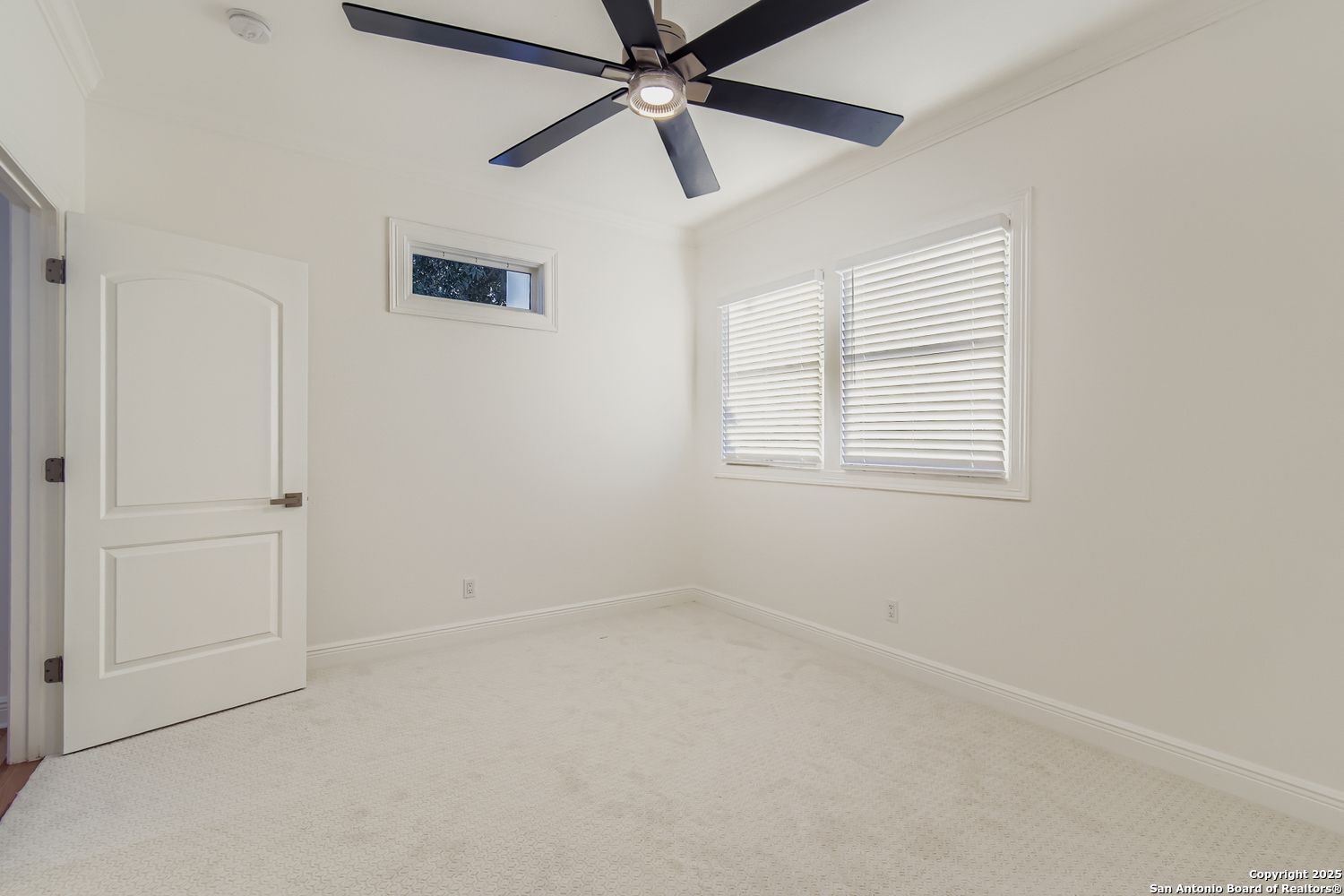 211 Elizabeth Road Terrell Hills, TX 78209 - Photo 16 of 29 an empty room with a window and a fan