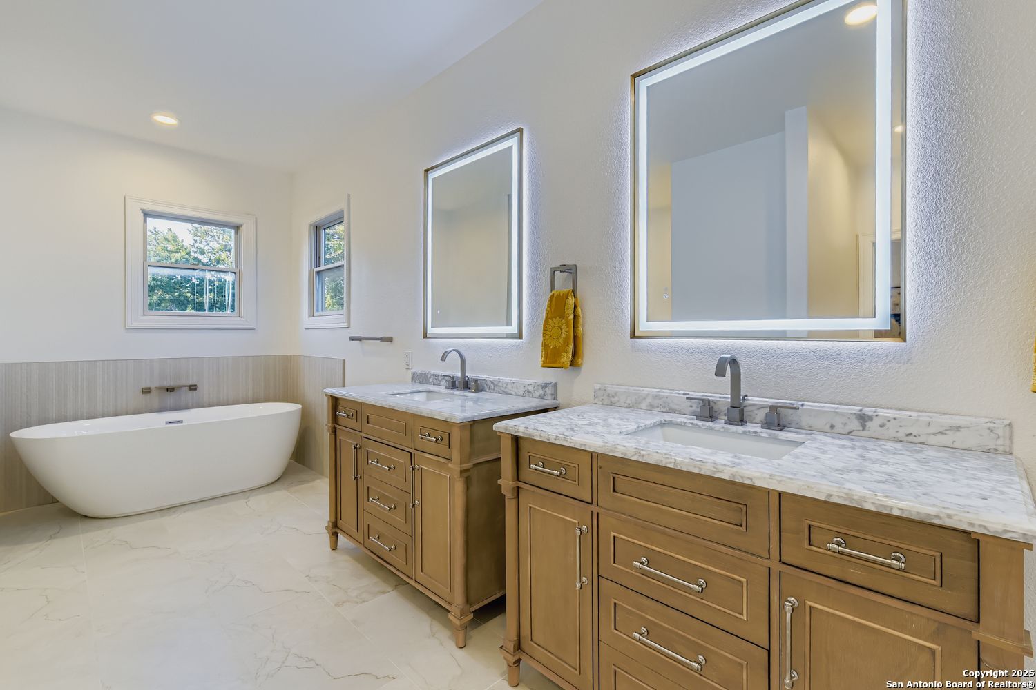 211 Elizabeth Road Terrell Hills, TX 78209 - Photo 19 of 29 a bathroom with a granite countertop double vanity sink mirror and bathtub
