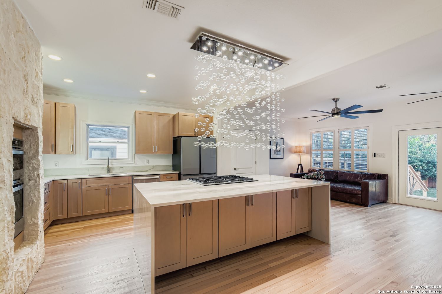 211 Elizabeth Road Terrell Hills, TX 78209 - Photo 5 of 29 a large kitchen with a stove a sink dishwasher and a refrigerator with wooden floor