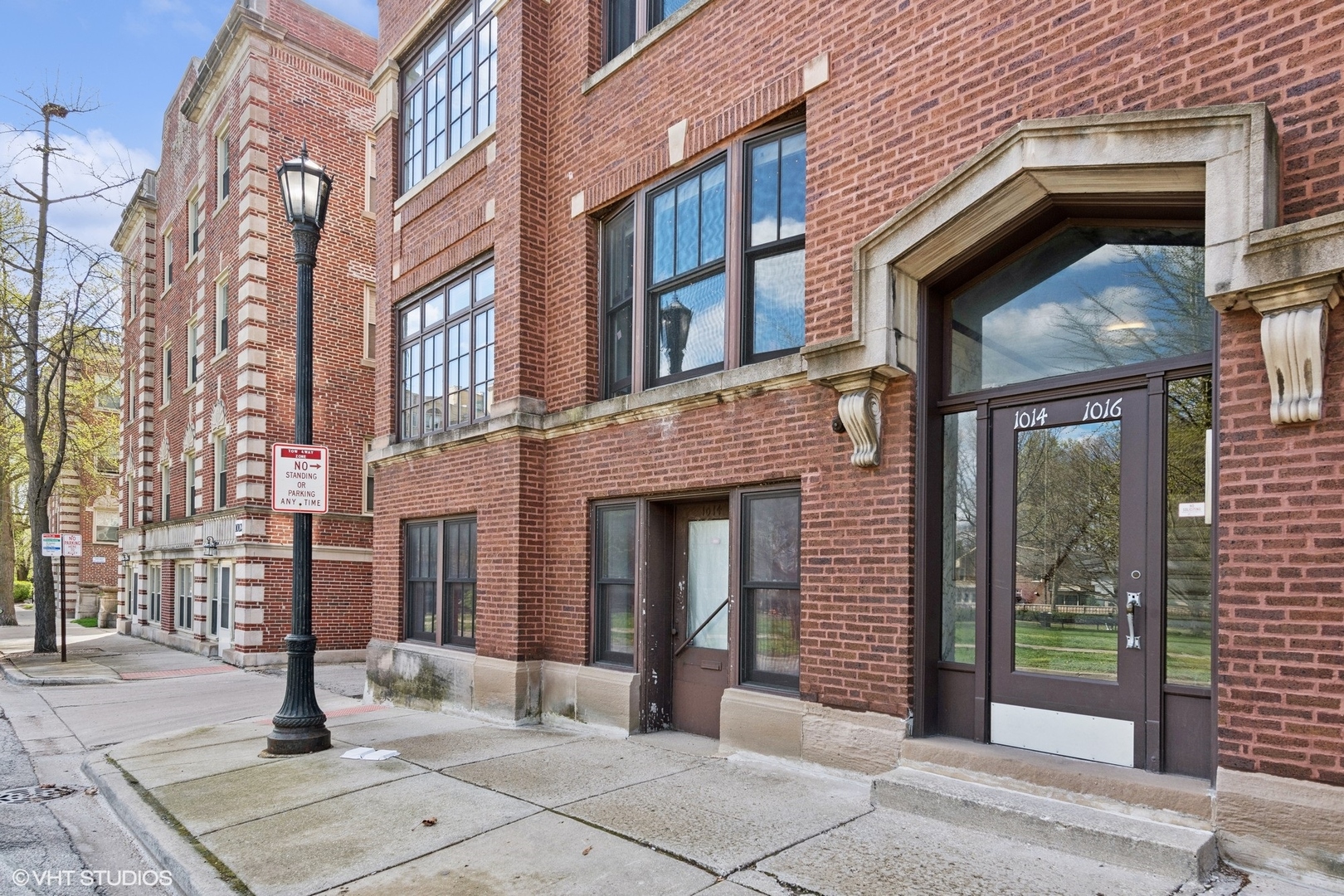 1016 Main Street, Unit 2 Evanston, IL 60202 - Photo 1 of 18 a front view of a brick building with many windows