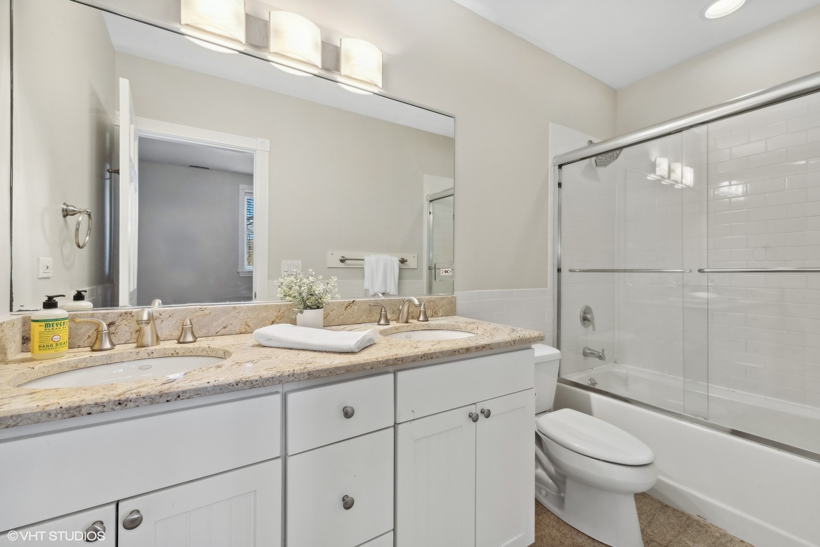 1016 Main Street, Unit 2 Evanston, IL 60202 - Photo 11 of 18 a bathroom with a granite countertop sink toilet and shower