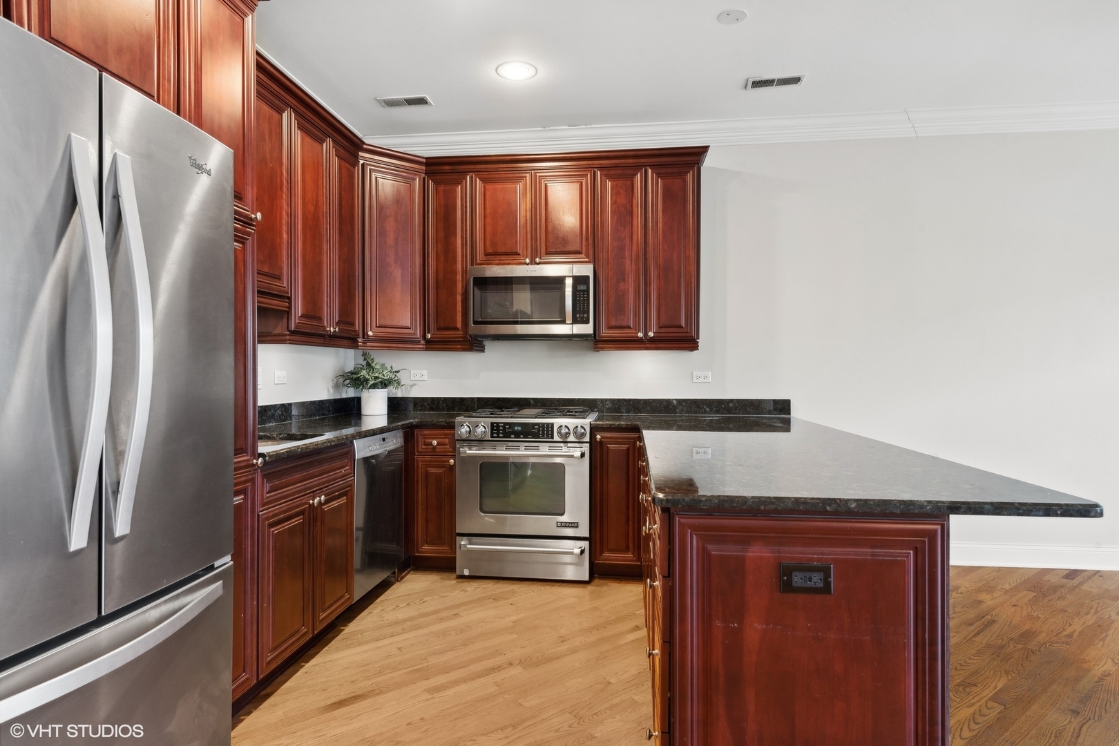 1016 Main Street, Unit 2 Evanston, IL 60202 - Photo 7 of 18 a kitchen with stainless steel appliances granite countertop a refrigerator stove and sink