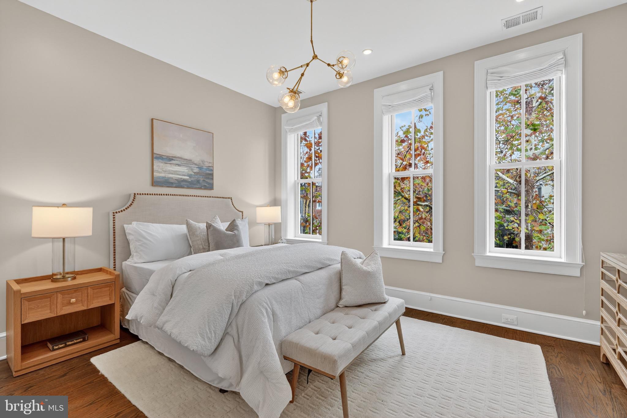114 4th Street Northeast Washington, DC 20002 - Photo 16 of 40 a spacious bedroom with a bed and wooden floor