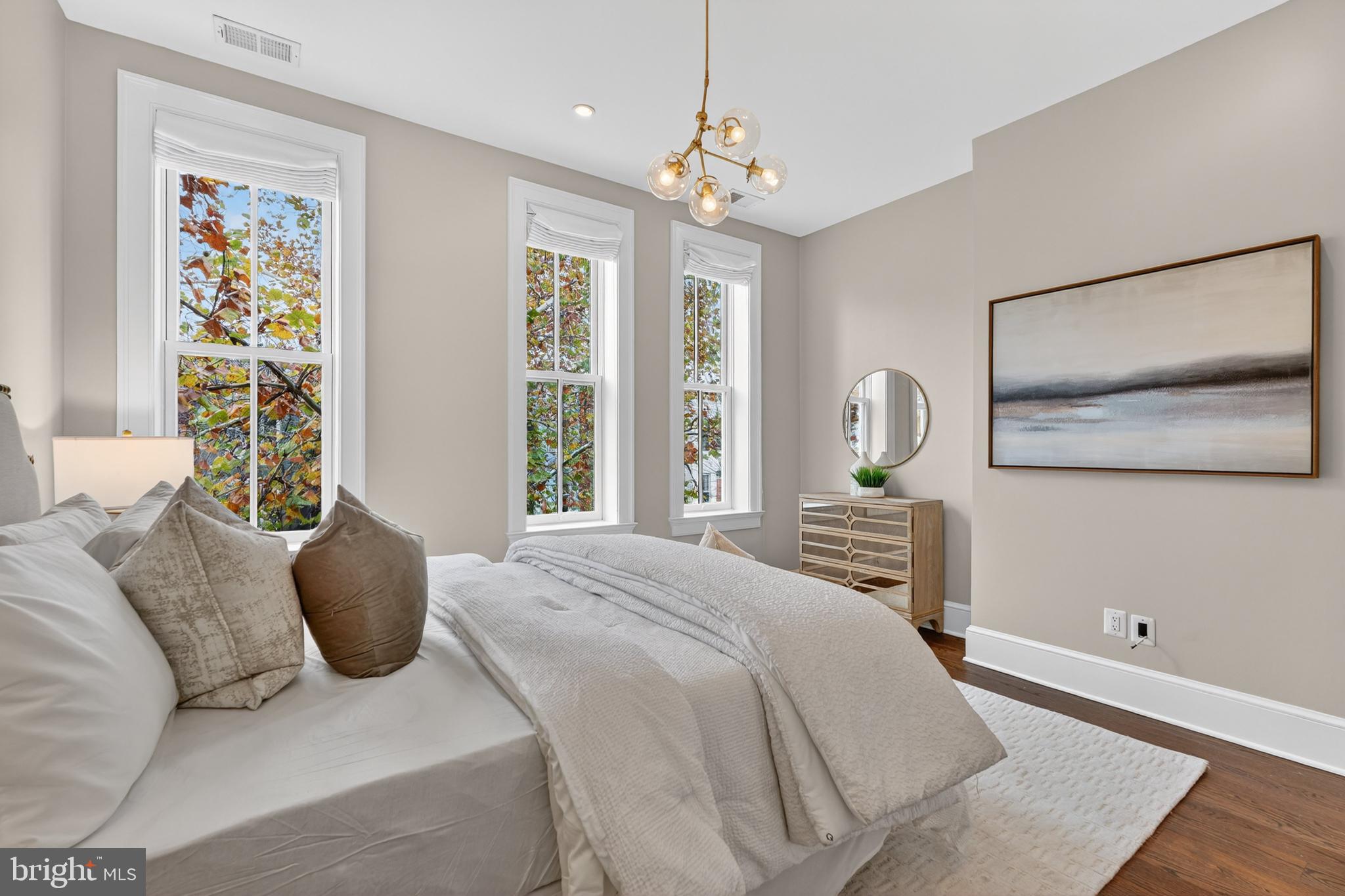 114 4th Street Northeast Washington, DC 20002 - Photo 18 of 40 a bedroom with a bed mirror and window