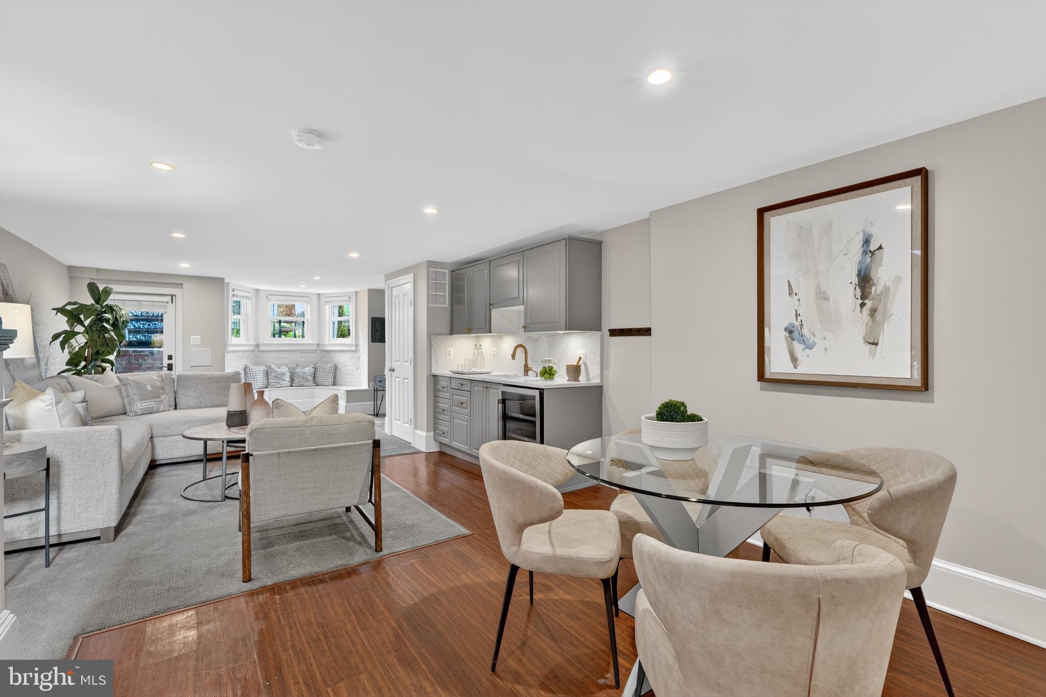 114 4th Street Northeast Washington, DC 20002 - Photo 27 of 40 a living room with furniture a dining table and kitchen view