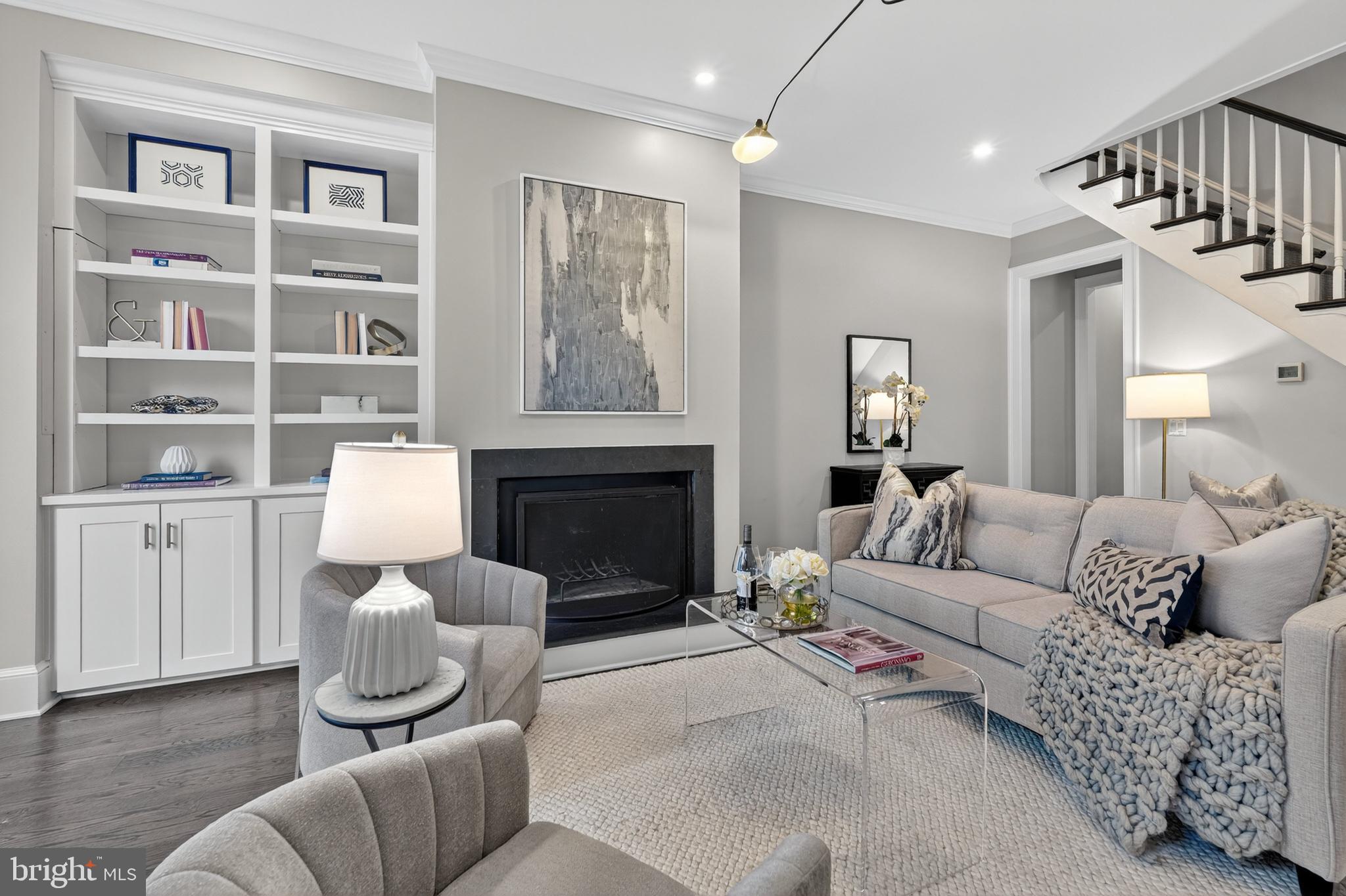 114 4th Street Northeast Washington, DC 20002 - Photo 3 of 40 a living room with furniture a rug and a fireplace
