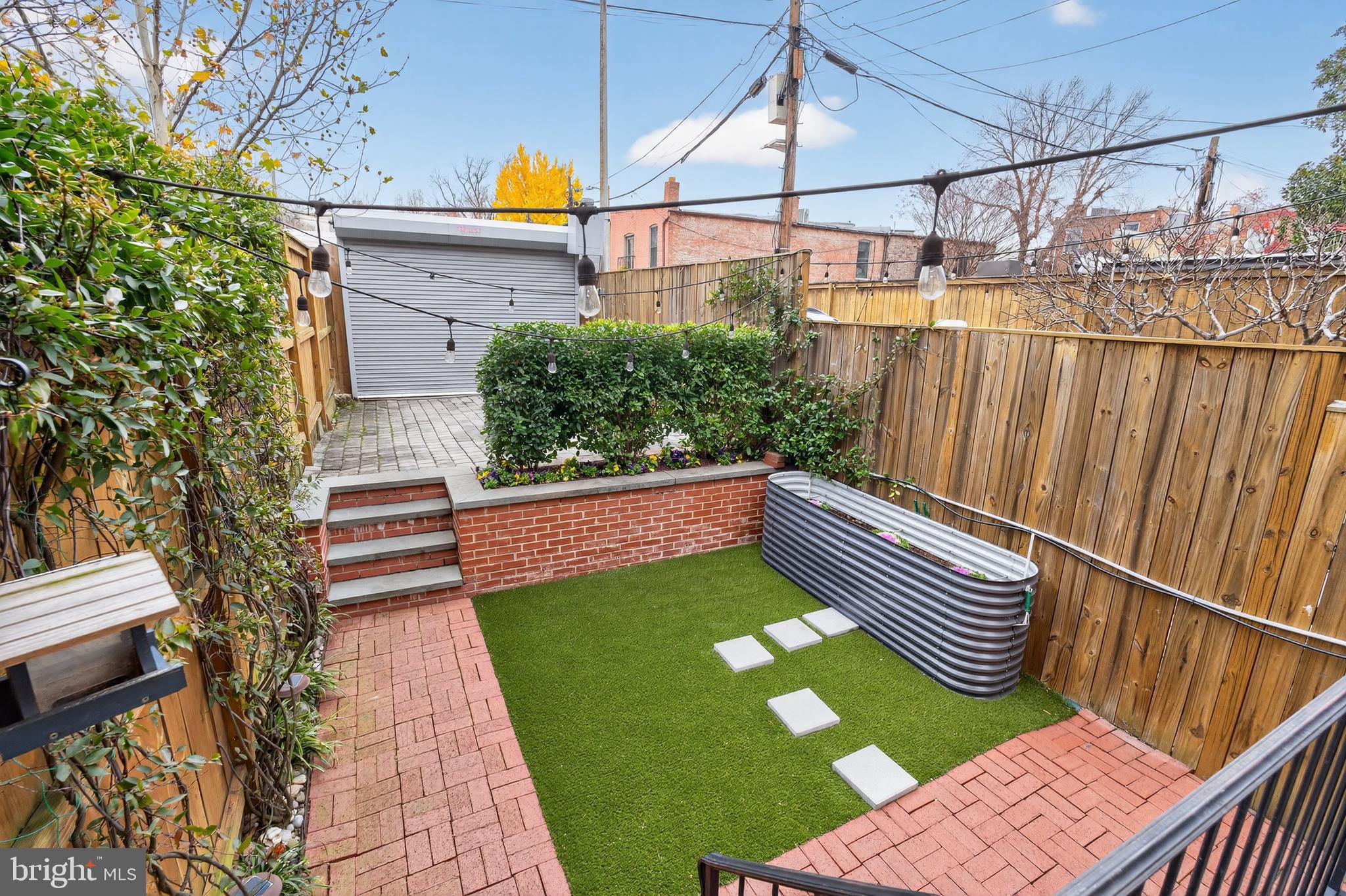 114 4th Street Northeast Washington, DC 20002 - Photo 39 of 40 a balcony with wooden floor and outdoor seating