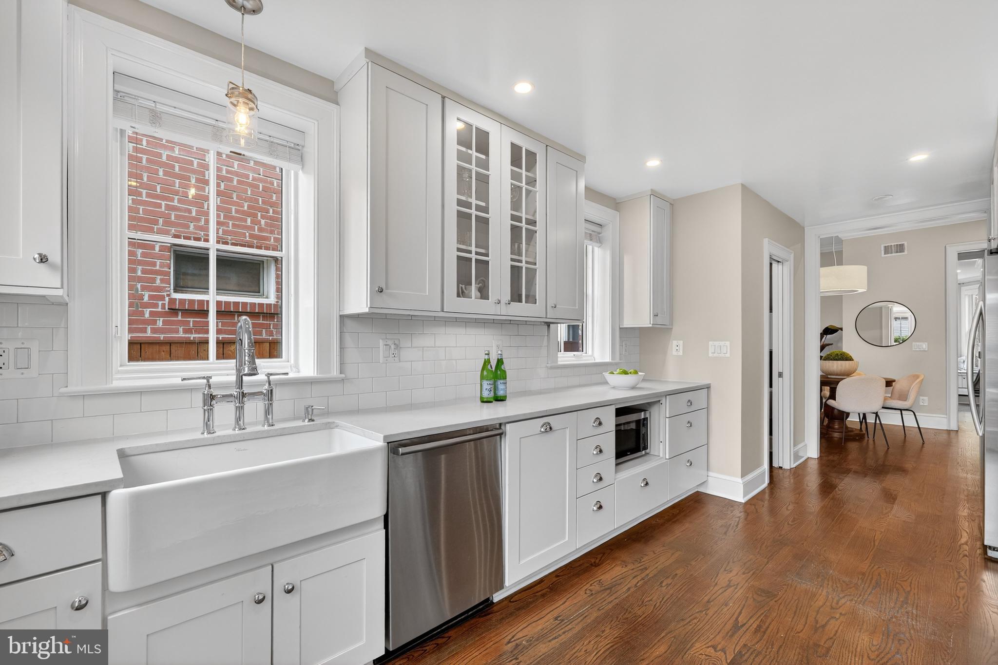 114 4th Street Northeast Washington, DC 20002 - Photo 10 of 40 a kitchen with stainless steel appliances granite countertop a stove and a sink
