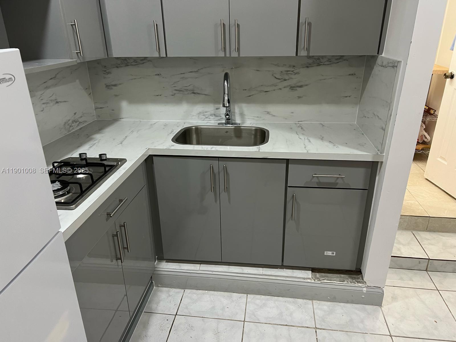 a kitchen with a sink and cabinets