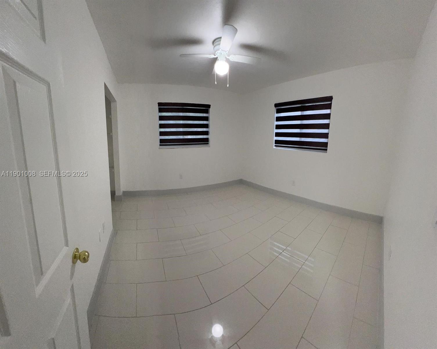 14331 Southwest 286th Street Homestead, FL 33033 - Photo 2 of 5 a view of empty room with windows
