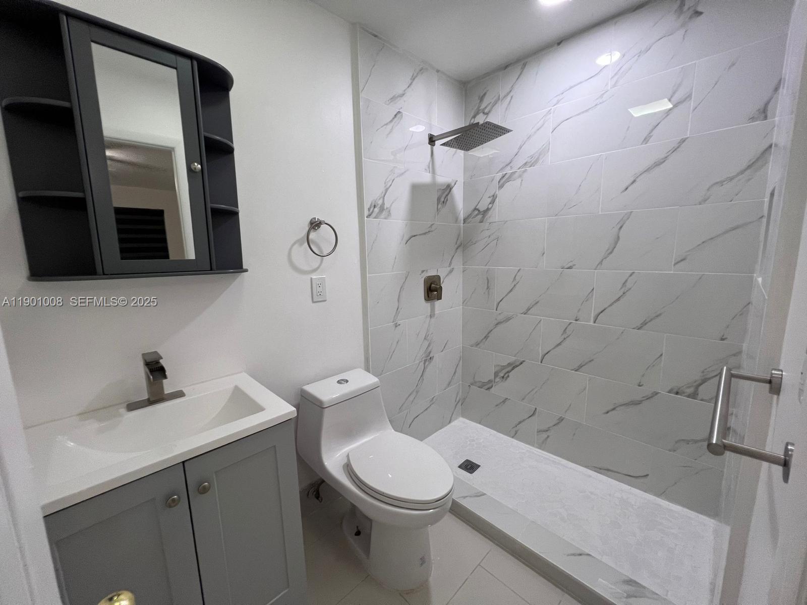 14331 Southwest 286th Street Homestead, FL 33033 - Photo 4 of 5 a bathroom with a sink a toilet and shower