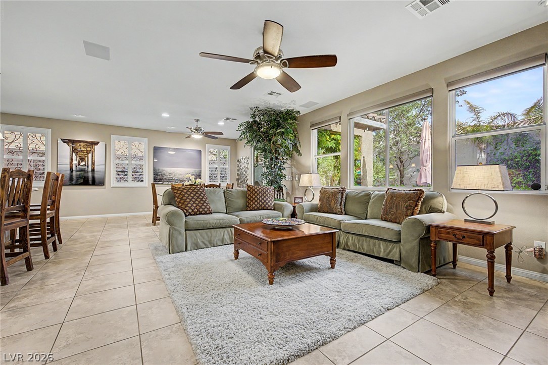 7415 Campbell Ranch Avenue Las Vegas, NV 89179 - Photo 14 of 52 A welcoming living space features ample natural light and a tiled floor for effortless entertaining.