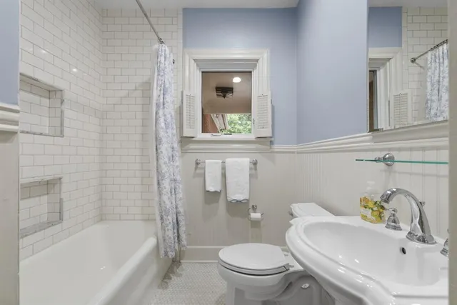 a bathroom with a sink toilet and bathtub
