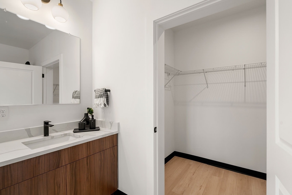 600 Broadway, Unit 406 Chelsea, MA 02150 - Photo 12 of 30 a bathroom with a sink and a mirror