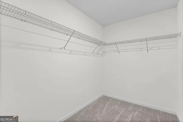 a view of a hallway with two rooms