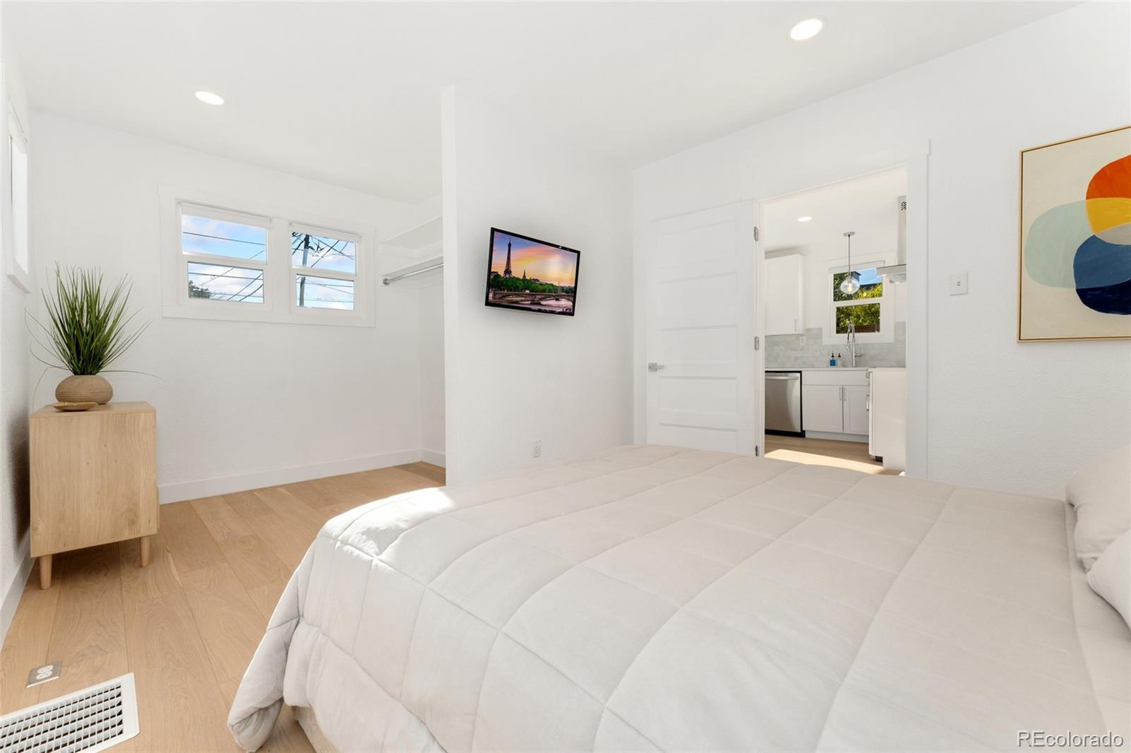 1528 Harrison Street Denver, CO 80206 - Photo 15 of 45 a bedroom with a bed and a couch