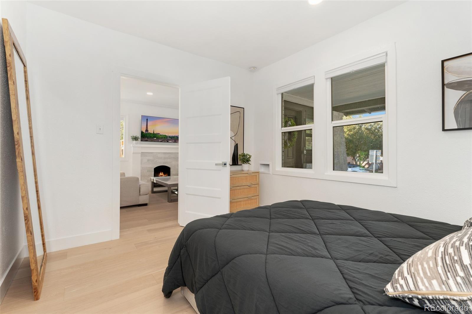 1528 Harrison Street Denver, CO 80206 - Photo 20 of 45 a bedroom with a bed and a window