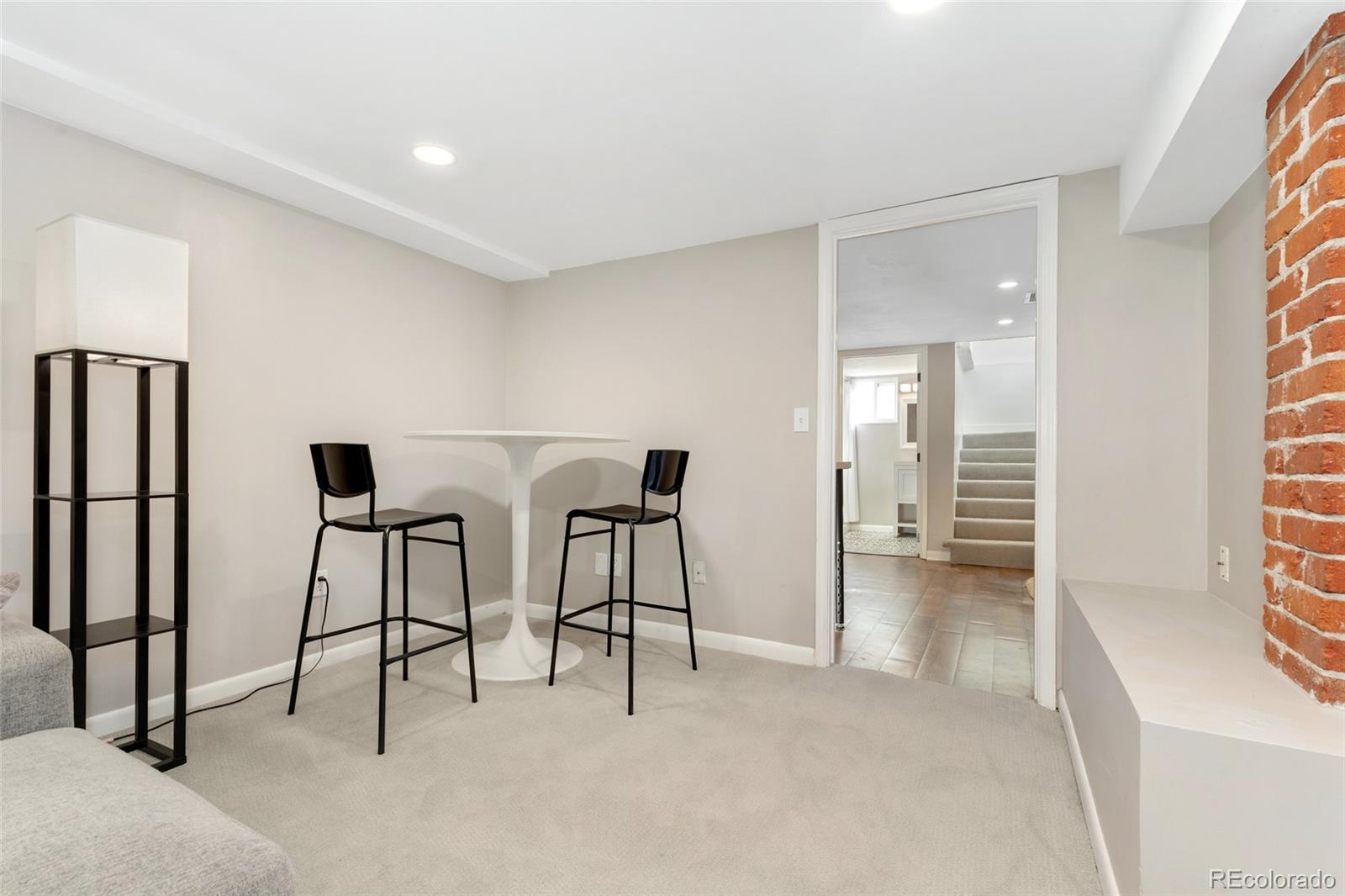 1528 Harrison Street Denver, CO 80206 - Photo 26 of 45 a view of a livingroom with furniture and windows