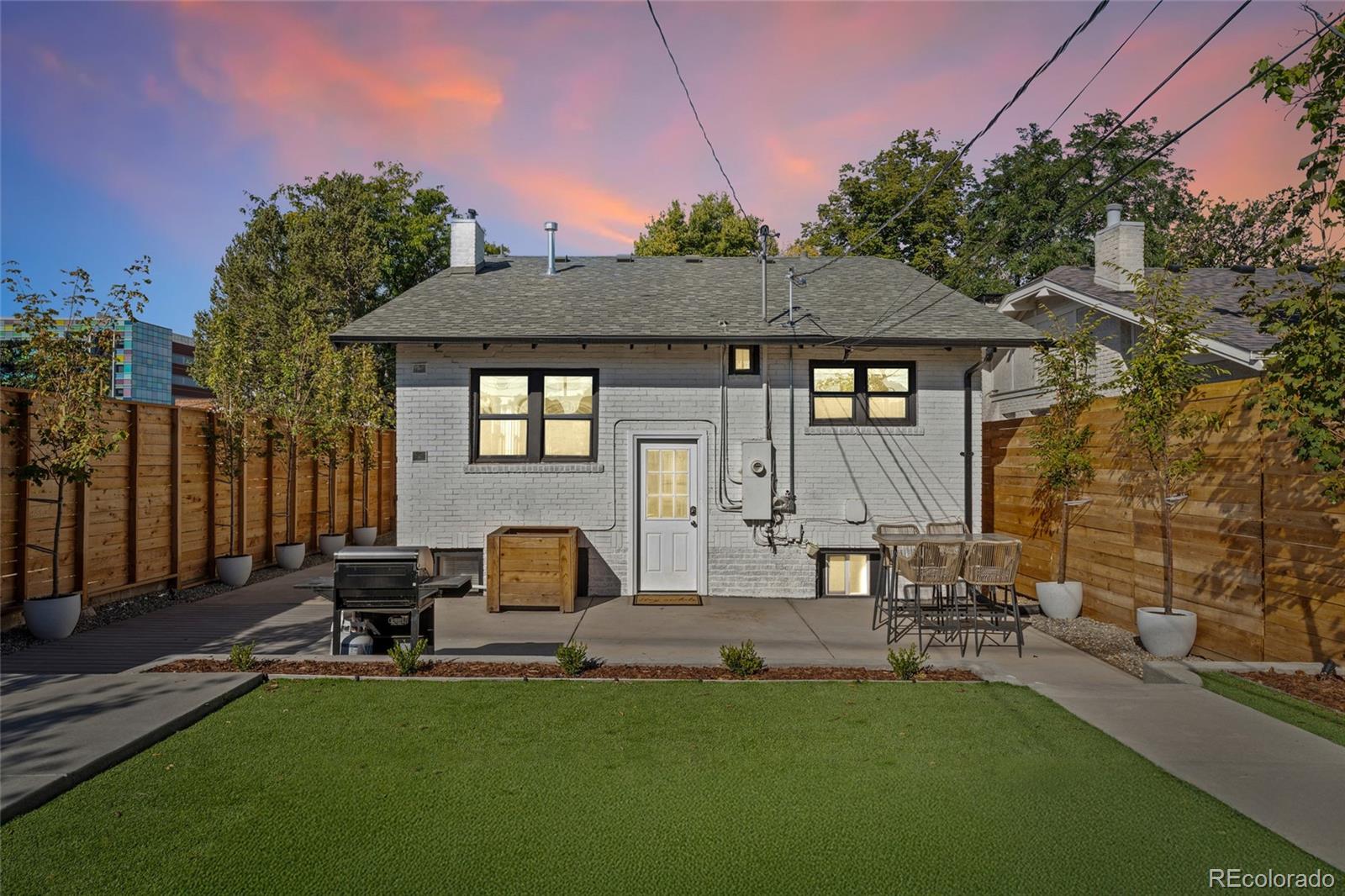 1528 Harrison Street Denver, CO 80206 - Photo 32 of 45 a house view with a sitting space and garden