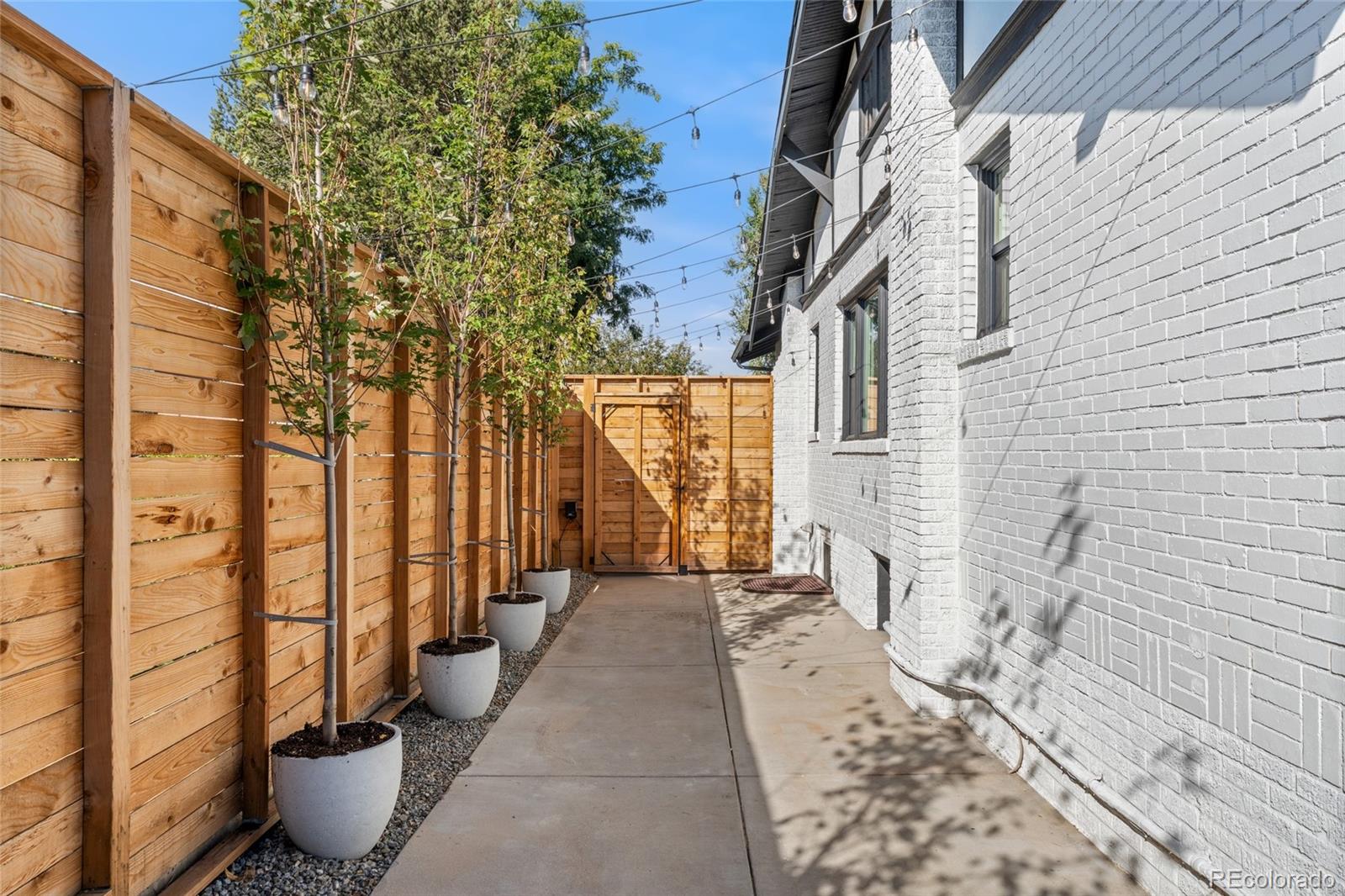 1528 Harrison Street Denver, CO 80206 - Photo 35 of 45 a view of a balcony with chair and flower pot