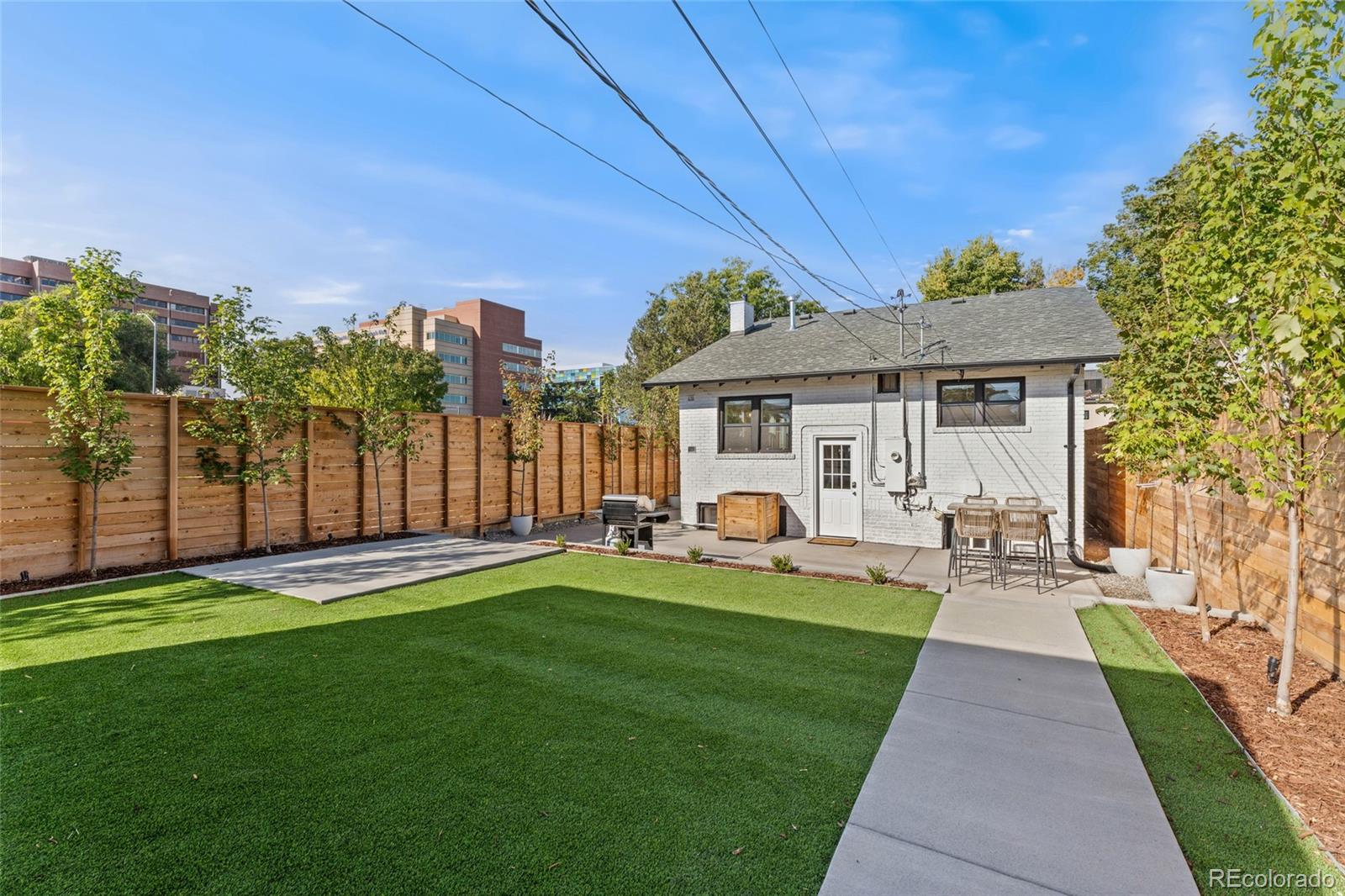 1528 Harrison Street Denver, CO 80206 - Photo 37 of 45 a front view of a house with patio
