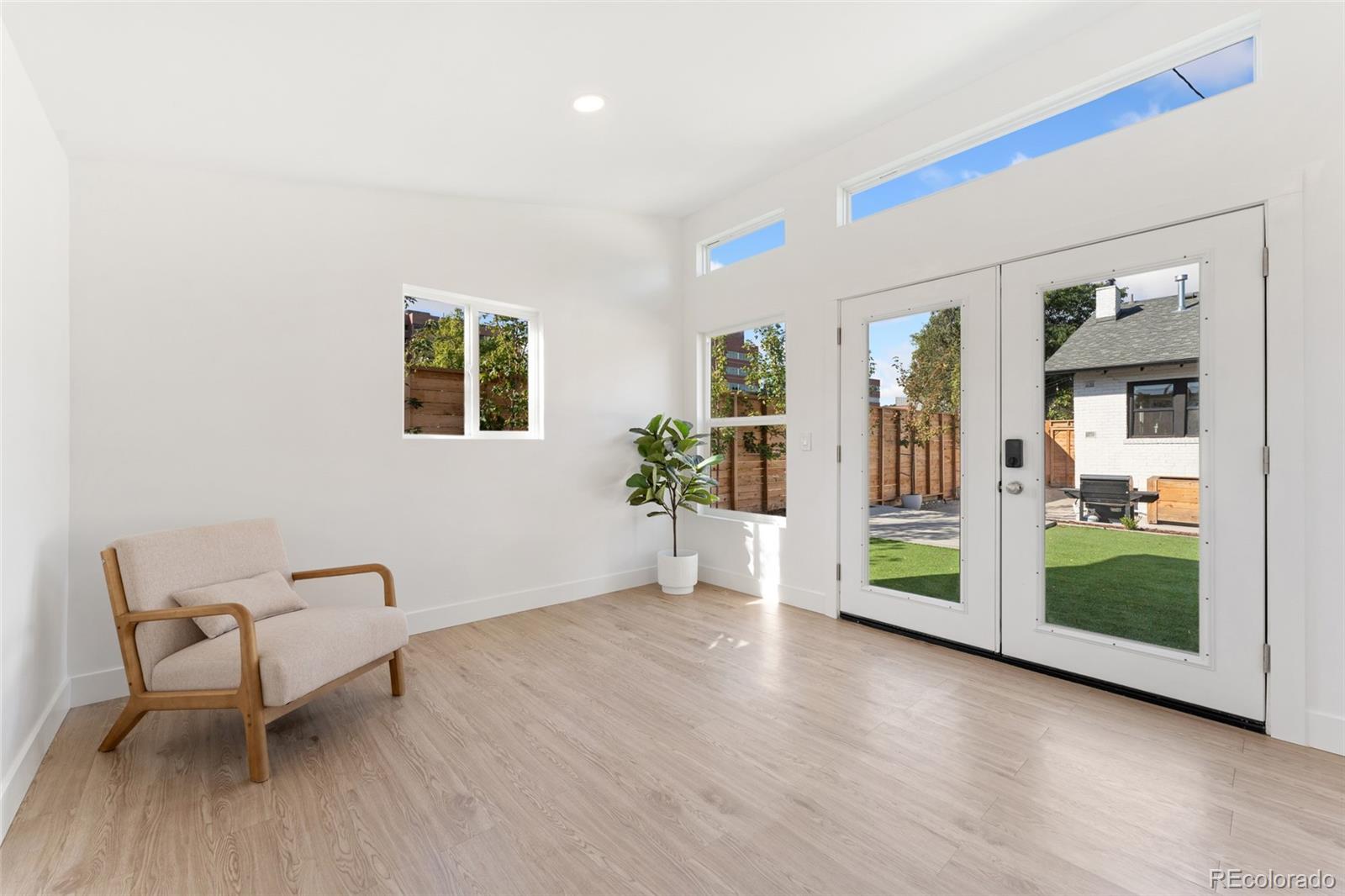 1528 Harrison Street Denver, CO 80206 - Photo 40 of 45 a view of livingroom with furniture and windows