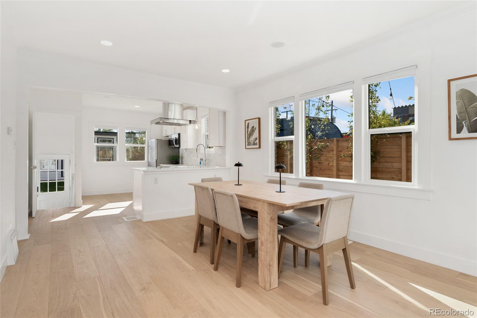 1528 Harrison Street Denver, CO 80206 - Photo 7 of 45 a view of a dining room with furniture window and wooden floor