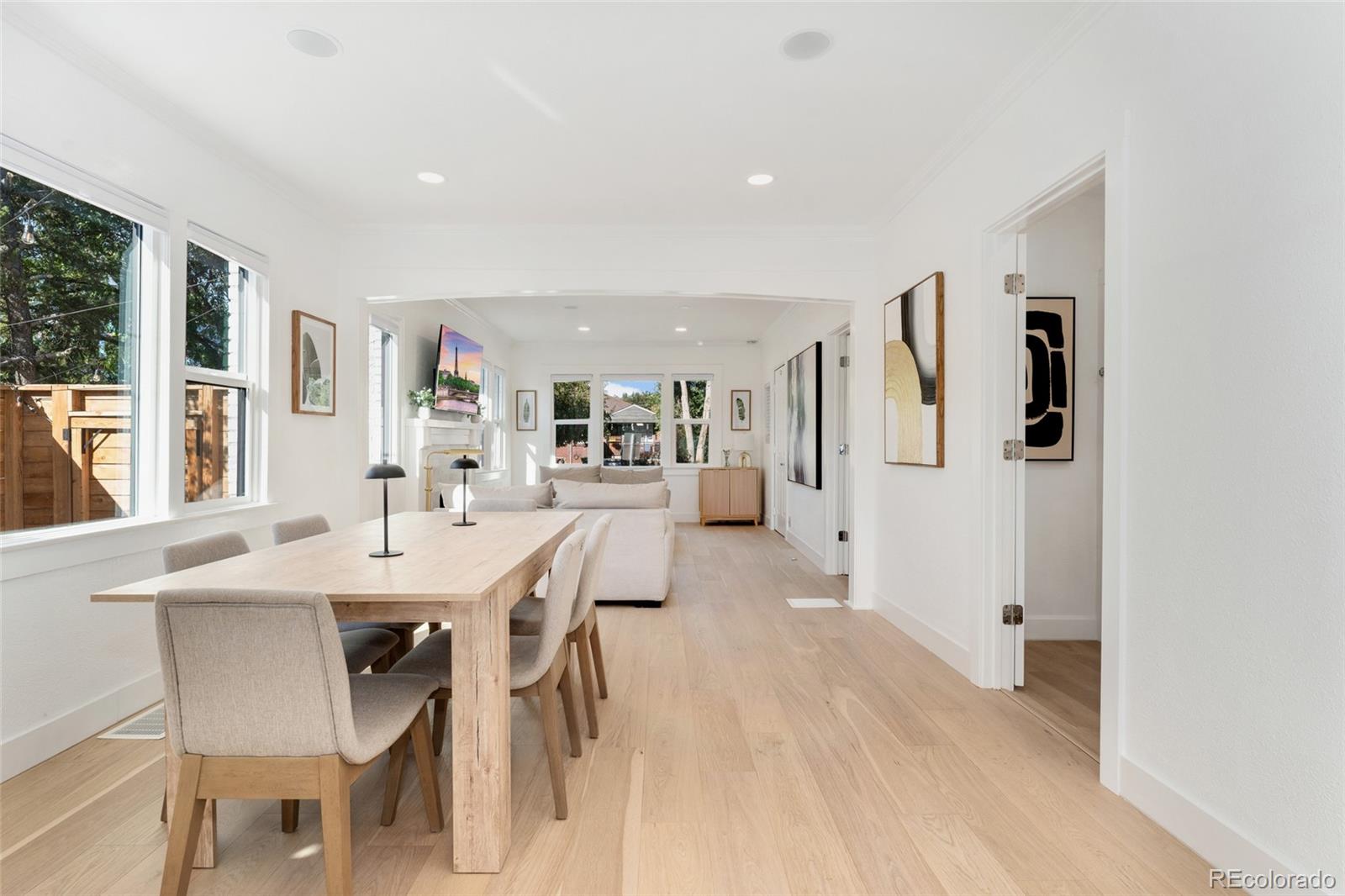1528 Harrison Street Denver, CO 80206 - Photo 8 of 45 a view of a dining room with furniture and a large window