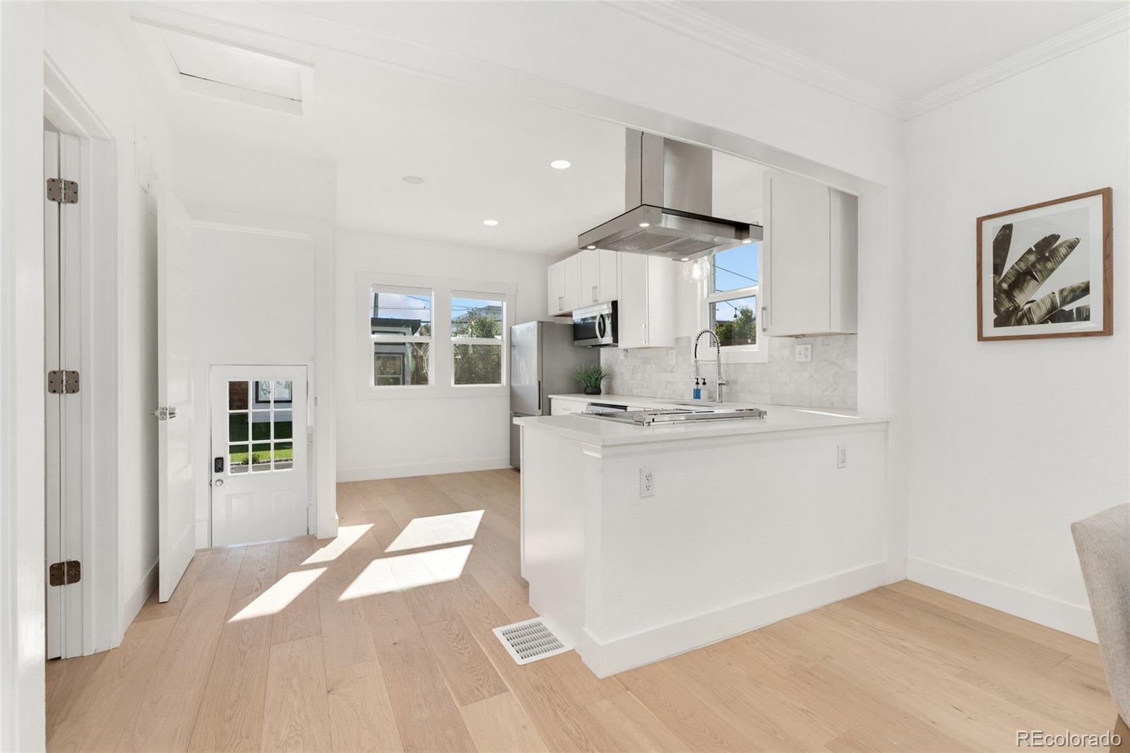 1528 Harrison Street Denver, CO 80206 - Photo 10 of 45 a room with a sink and a mirror