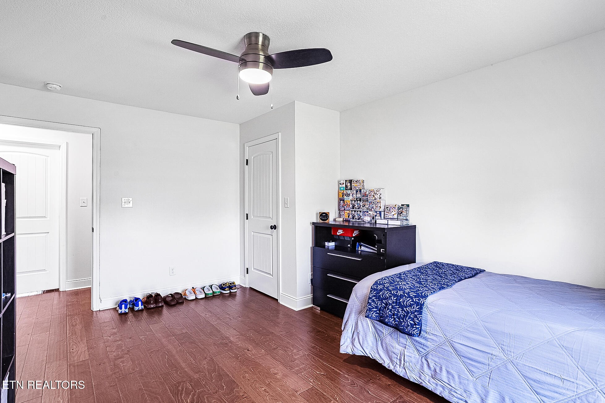 437 Covenant Way Seymour, TN 37865 - Photo 27 of 41 a bedroom with a bed and wooden floor