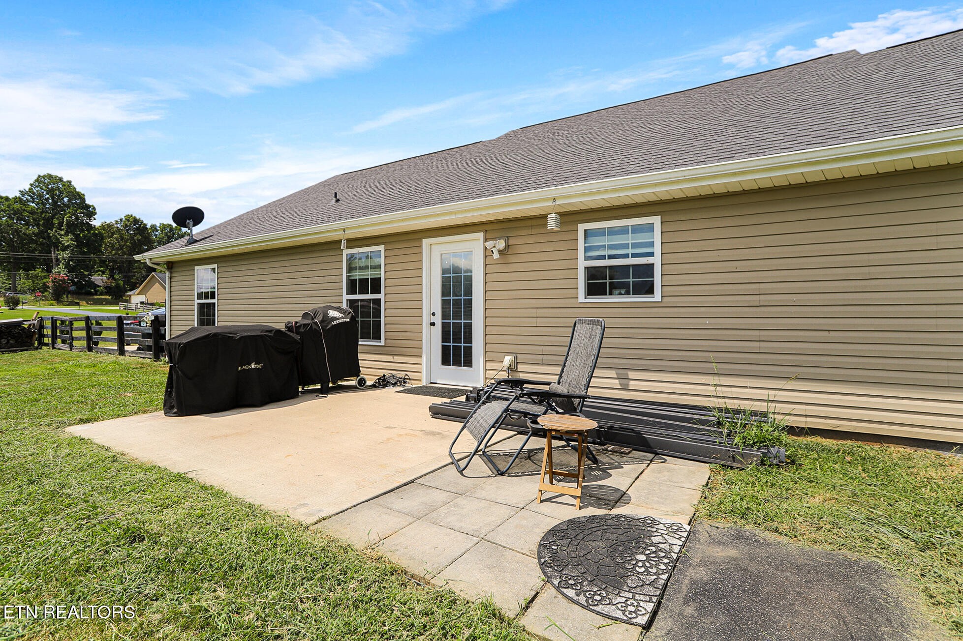 437 Covenant Way Seymour, TN 37865 - Photo 37 of 41 a view of a patio with table and chairs with wooden fence