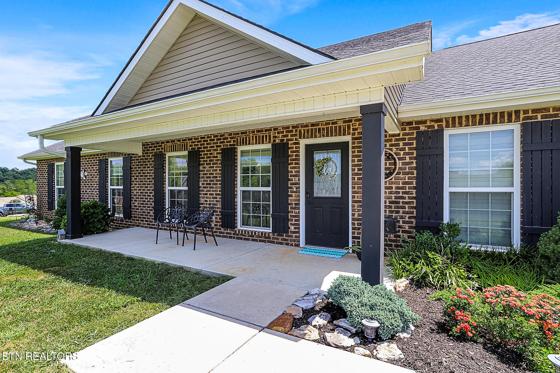 437 Covenant Way Seymour, TN 37865 - Photo 41 of 41 a view of a house with garden and a bench