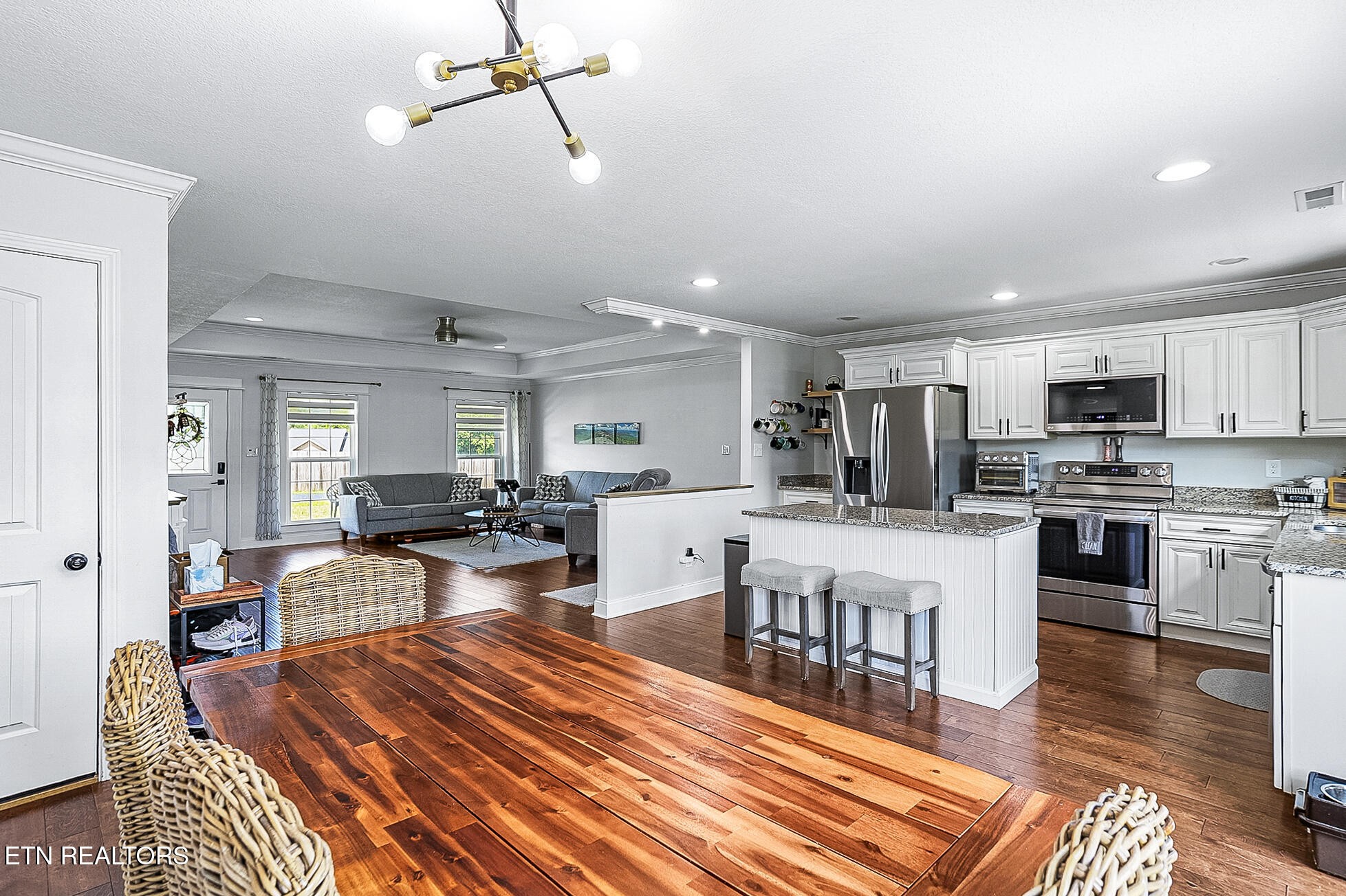 437 Covenant Way Seymour, TN 37865 - Photo 8 of 41 a large kitchen with white cabinets and stainless steel appliances