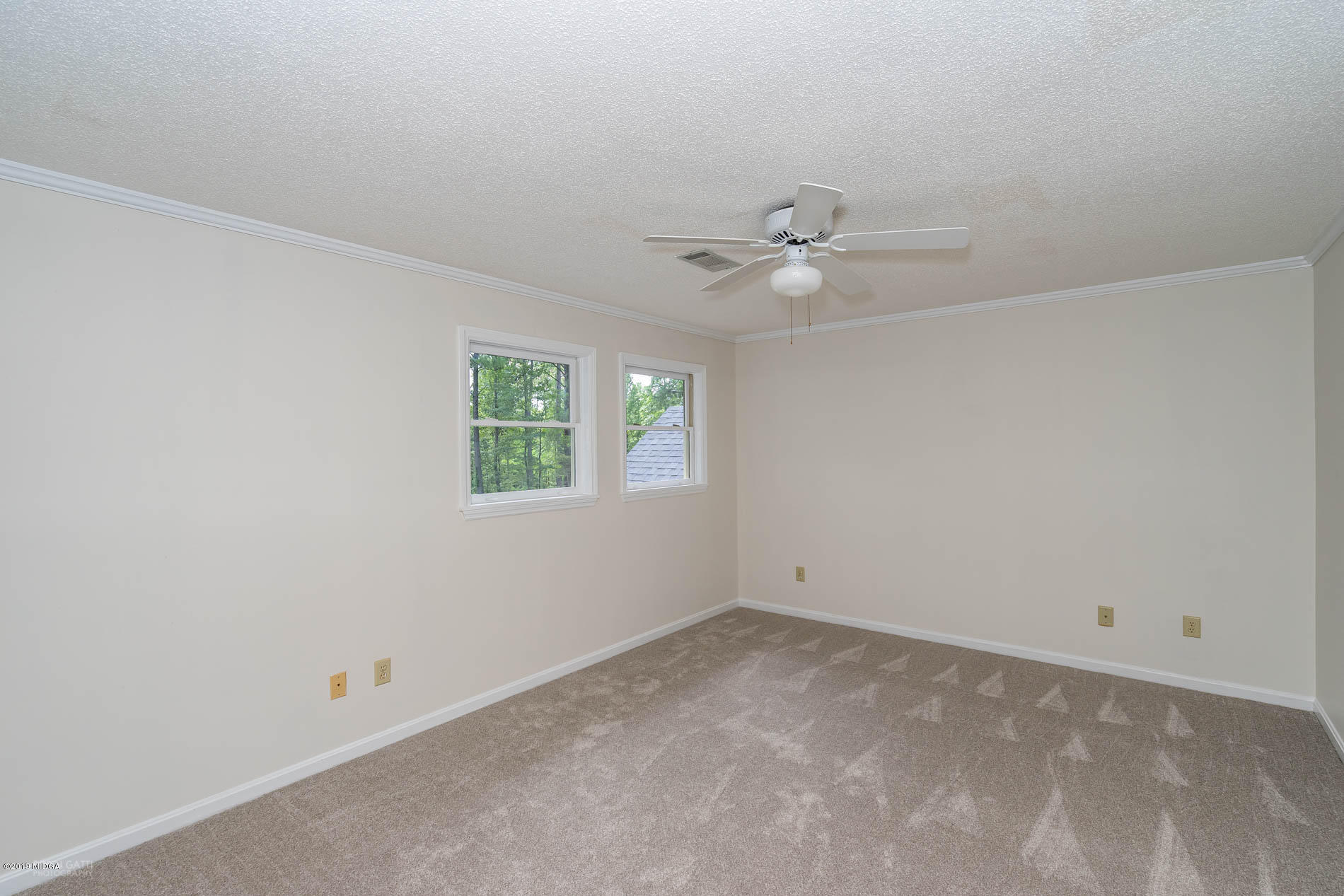 1041 Pate Road Juliette, GA 31046 - Photo 11 of 16 an empty room with a window and a ceiling fan