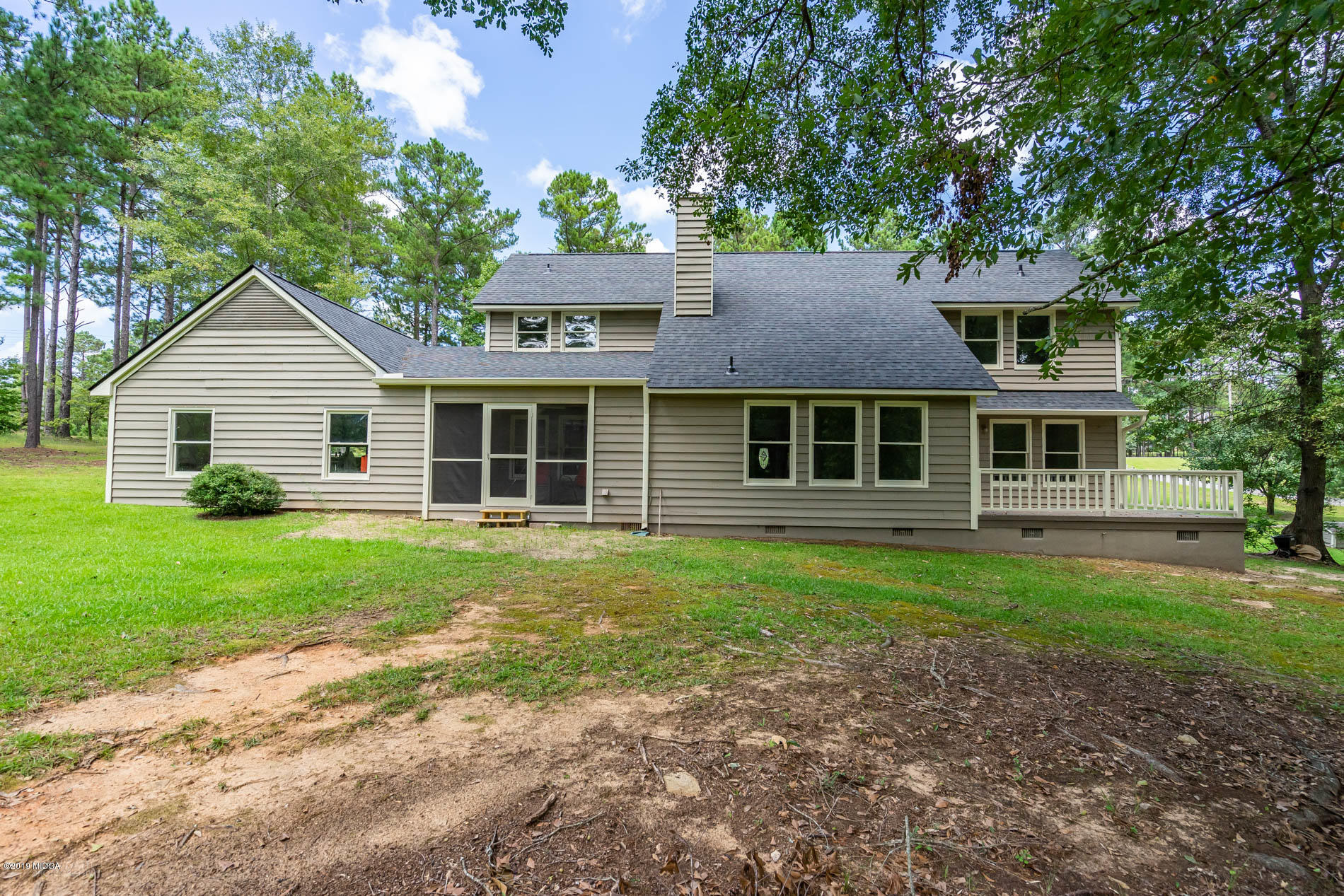 1041 Pate Road Juliette, GA 31046 - Photo 15 of 16 a front view of a house with a garden