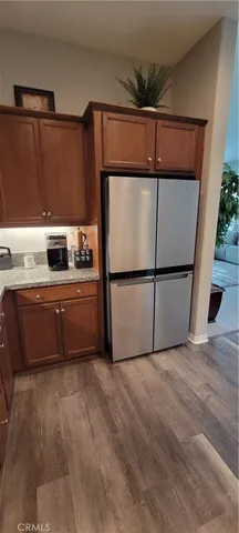 a kitchen with a refrigerator and a sink