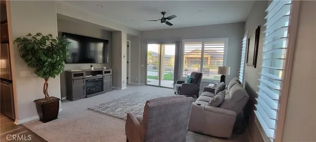 a kitchen with kitchen island a potted plant a sink and a stove