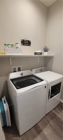 a utility room with washer and dryer