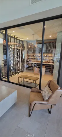 a living room with furniture a table and a large window