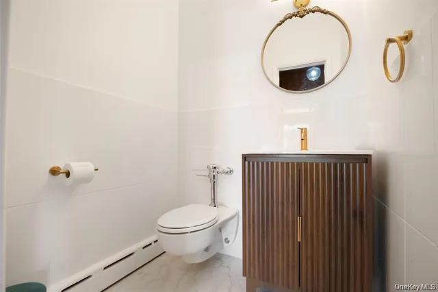 a bathroom with a toilet and a sink