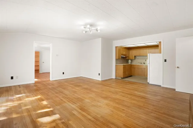 a view of an empty room with a bathroom