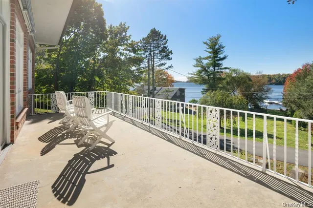 a view of balcony with furniture