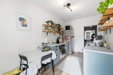 a kitchen with a sink cabinets and appliances
