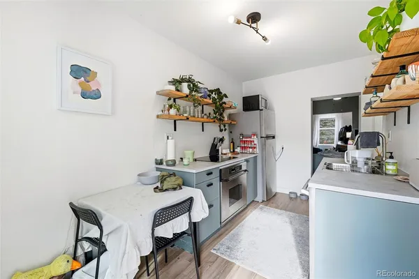 a kitchen with a sink cabinets and appliances