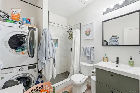 a view of a utility room with sink washer and dryer