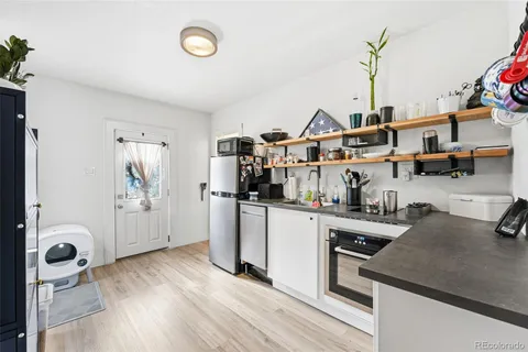 a kitchen with sink cabinets and window