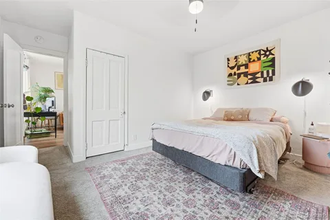 a bedroom with a bed and a couch