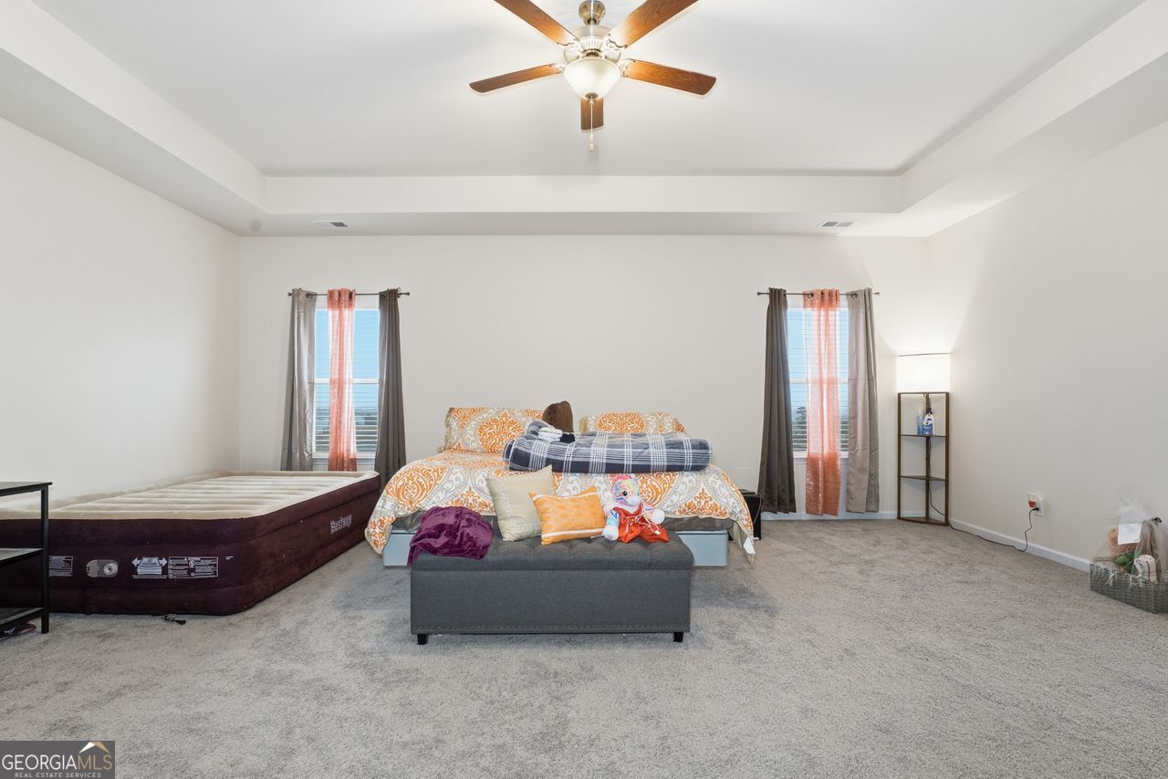 223 Malbone Street Southwest, Unit 5B Cartersville, GA 30120 - Photo 20 of 38 a bedroom with a bed and window